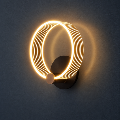 Orla Black and Gold LED Circle Wall Light for Bedsides and Hallways