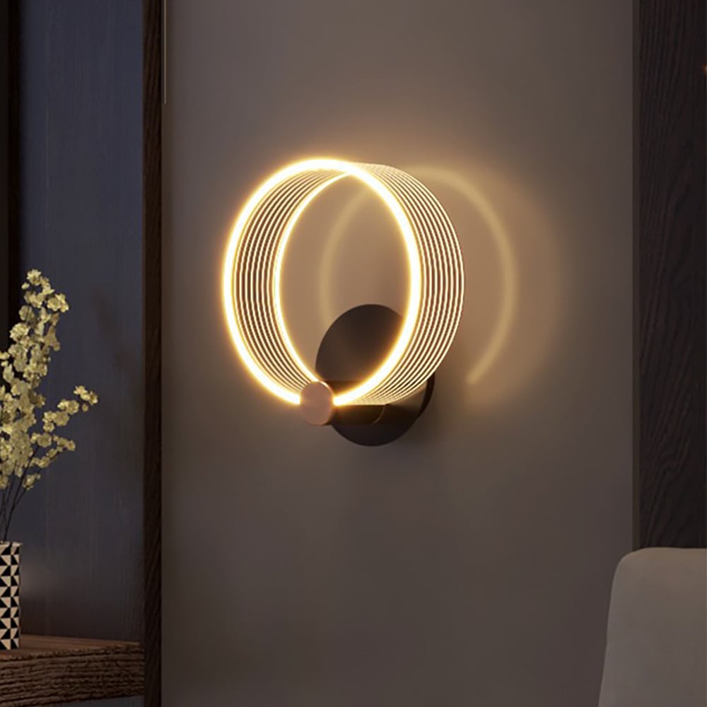 Modern circle wall light in black and gold