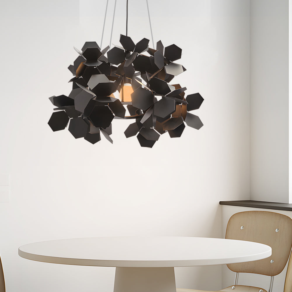 Black iron chandelier above a minimalist table