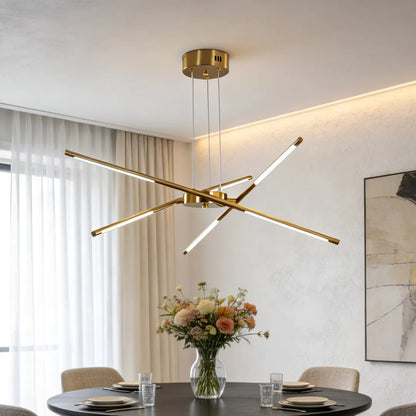 Gold linear sputnik chandelier over a dining table